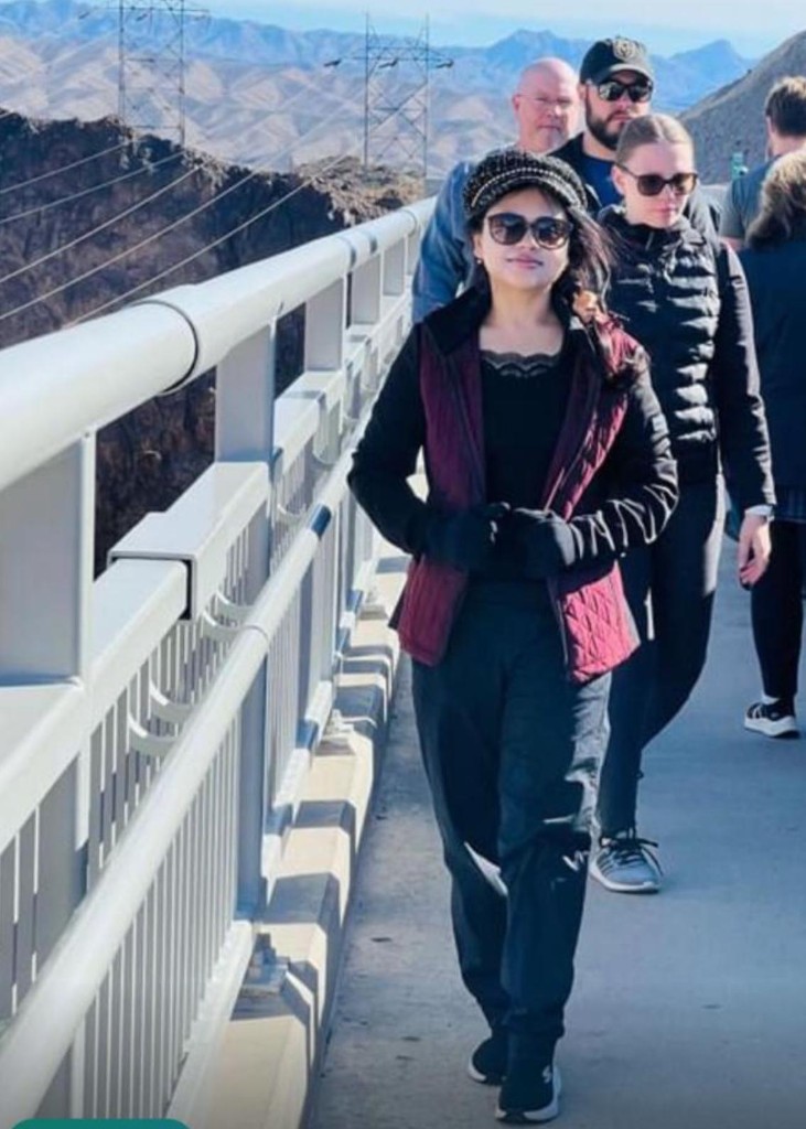 Ritupriya Mitra on a scenic bridge during travel